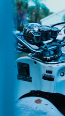 Close-up of a damaged motorcycle being inspected by an appraiser.