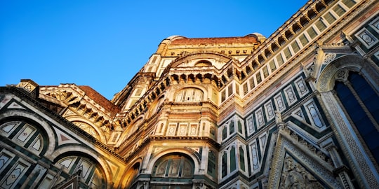 brown and gray concrete building in Cathedral of Santa Maria del Fiore Italy