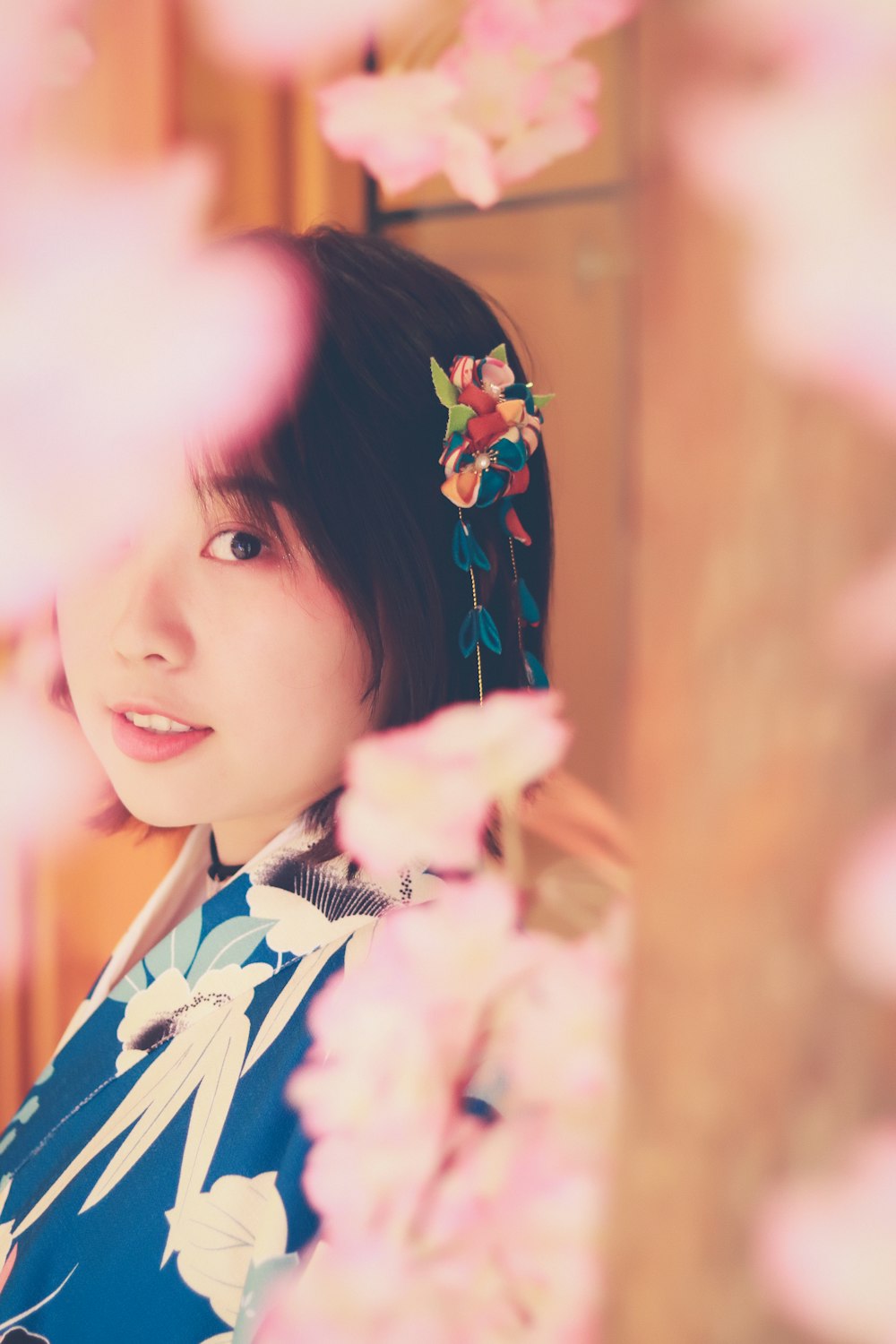 woman in blue and white floral blouse