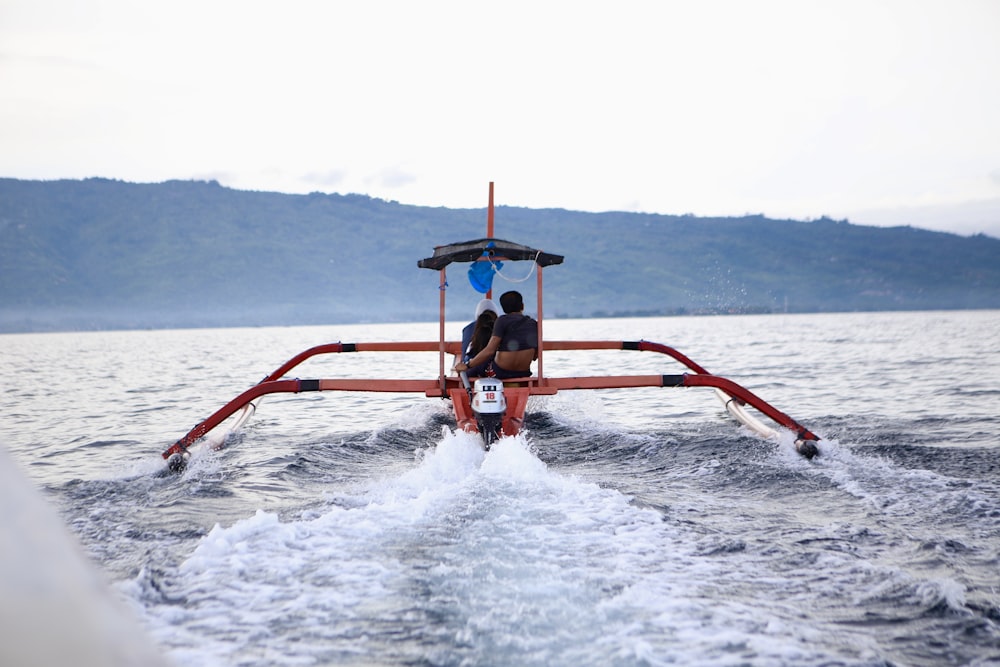 men riding boat