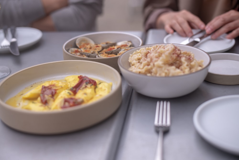 three breakfast food on dining table