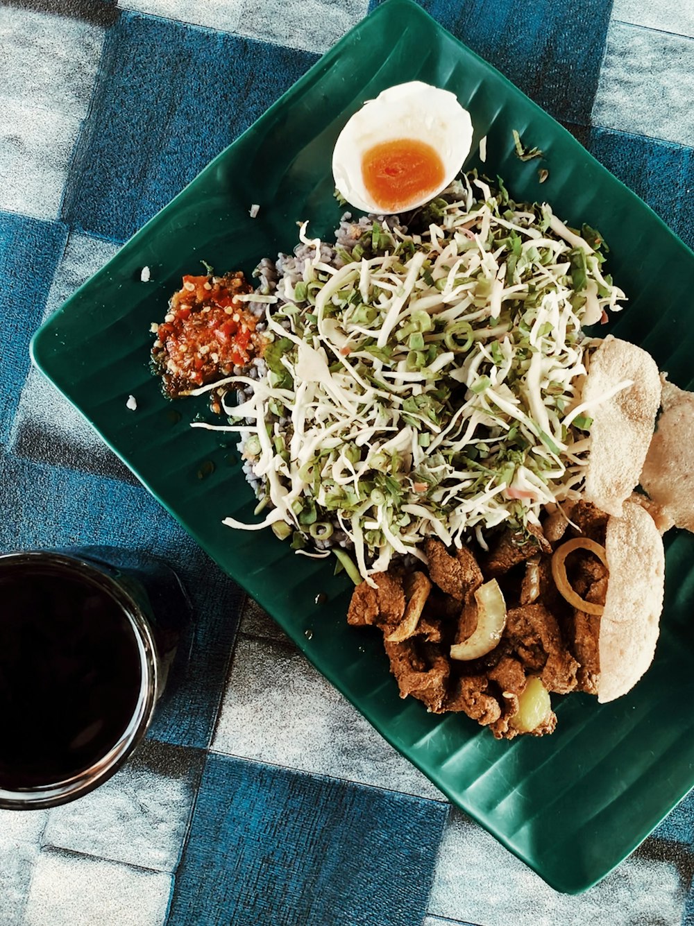 rice,vegetables and meat on green rectangular ceramic plate