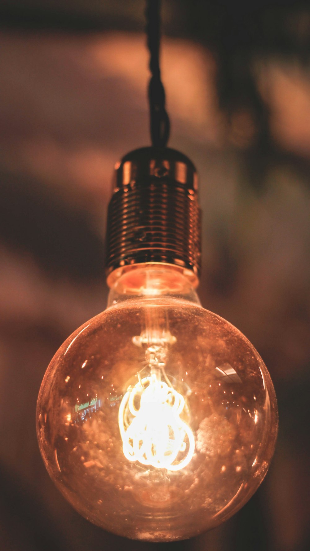 a light bulb hanging from a ceiling