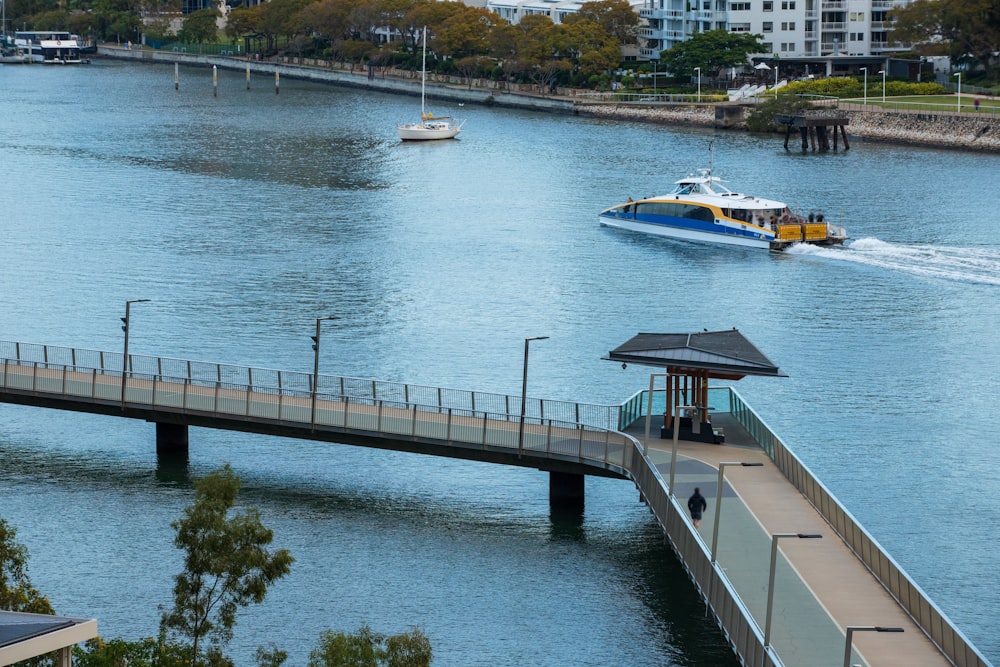 aerial photography of a speedboat passing by a river