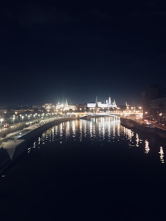 Nighttime reflections of Budapest's illuminated skyline shimmering on the Danube.