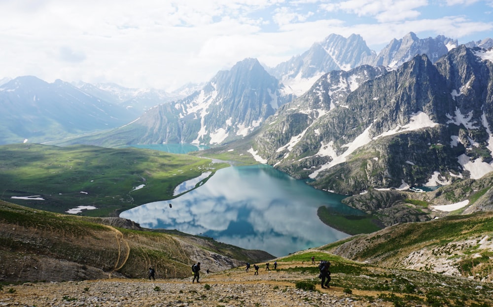 aerial photography of lake between mountain during daytime