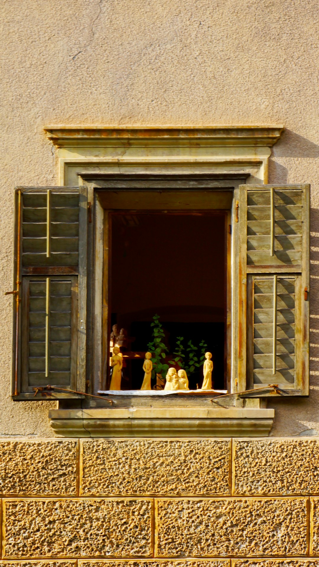 white figurine on window
