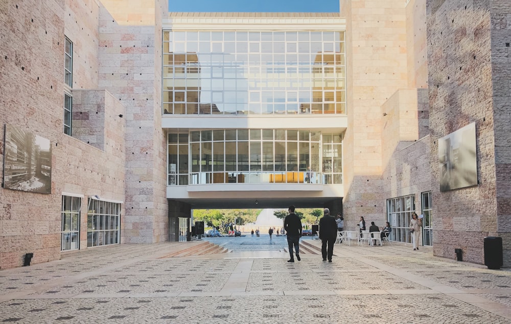 people walking on pathway near buildings