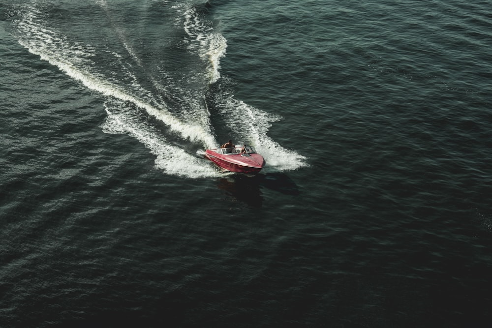 person riding powerboat on body of water