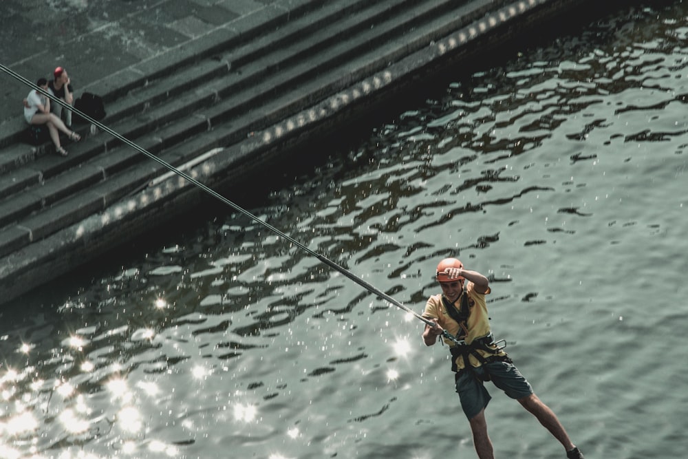 a man on a water ski being pulled by a rope