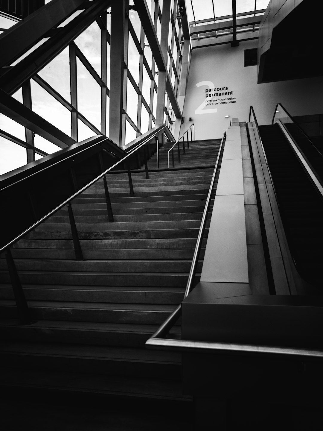 grayscale photography of low-angle concrete stairs