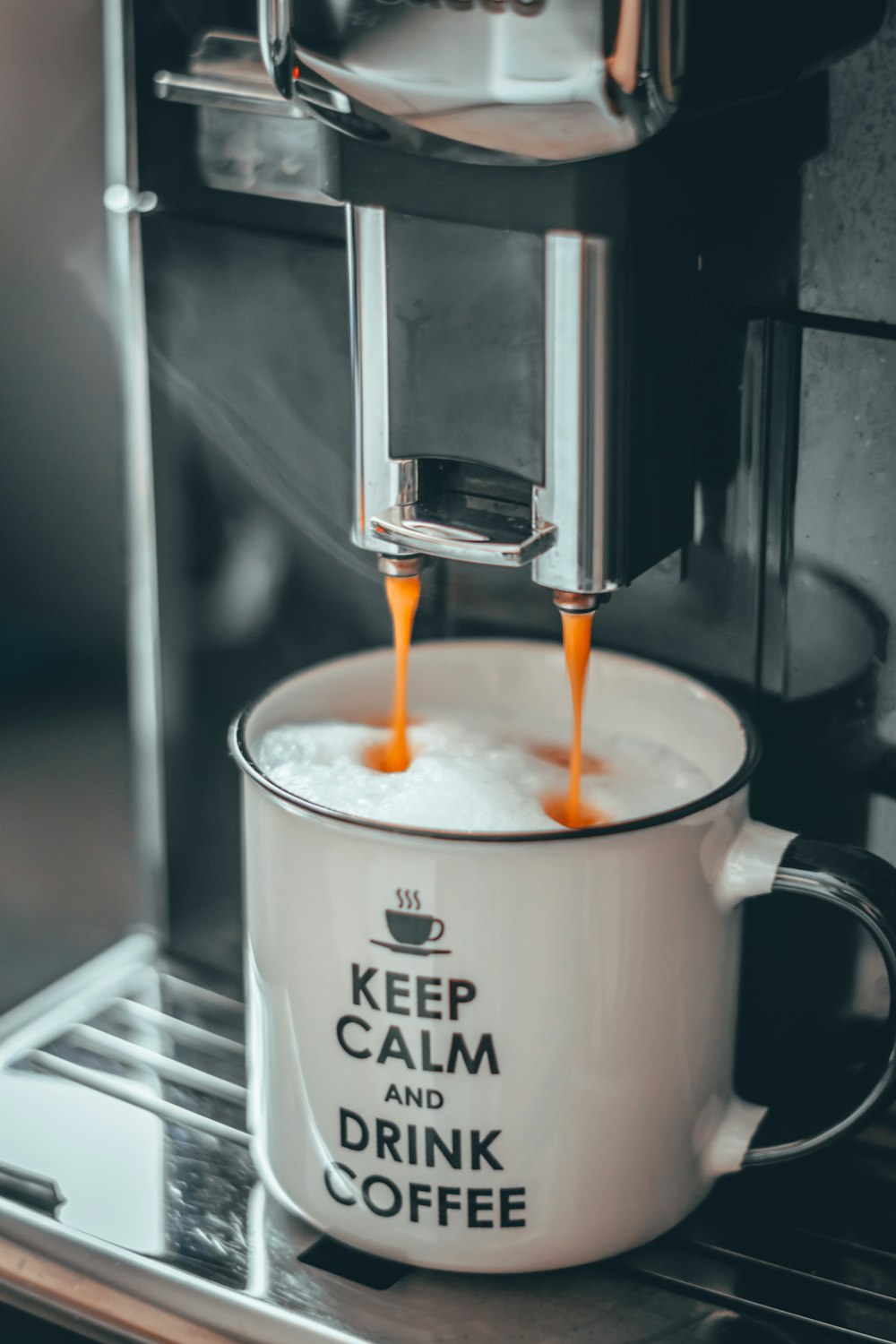 cream on white and black mug