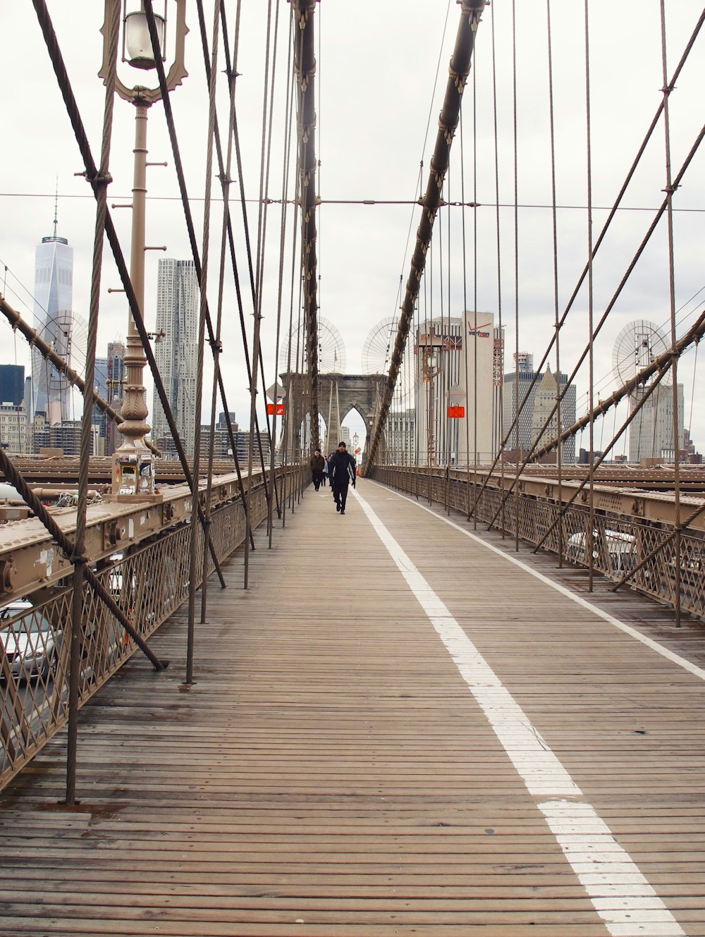 people walking on bridge during dayime