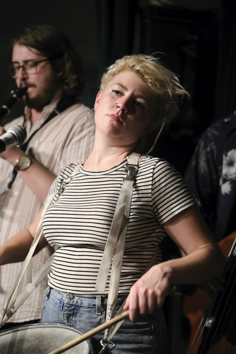 woman wearing grey and black stripe blouse