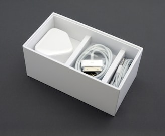 A neatly packaged set of headphones in a simple, generic box.