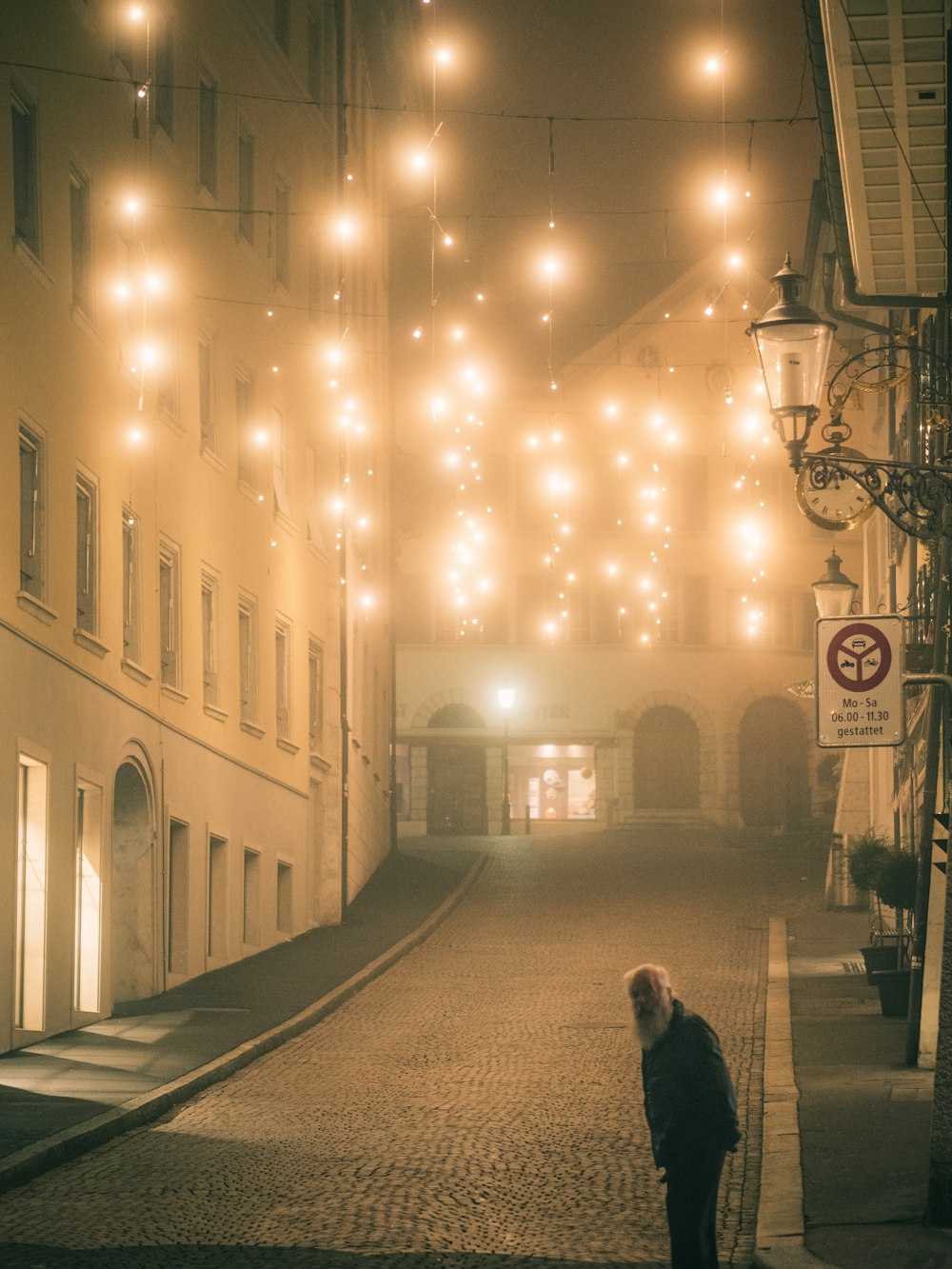 man standing on road