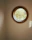 Close-up of a newly installed egress window letting in natural light to a cozy basement corner.