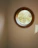 Close-up of a newly installed egress window letting in natural light to a cozy basement corner.