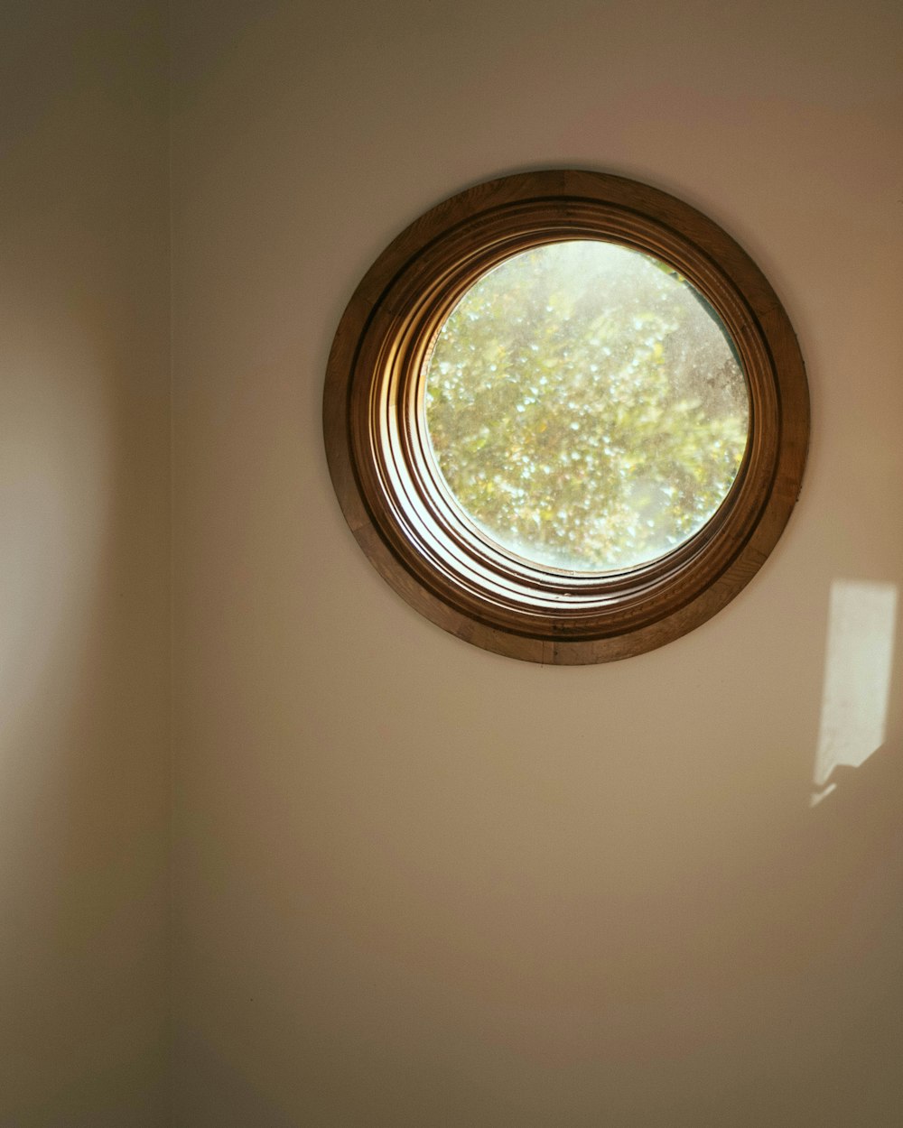 a round window in the corner of a room