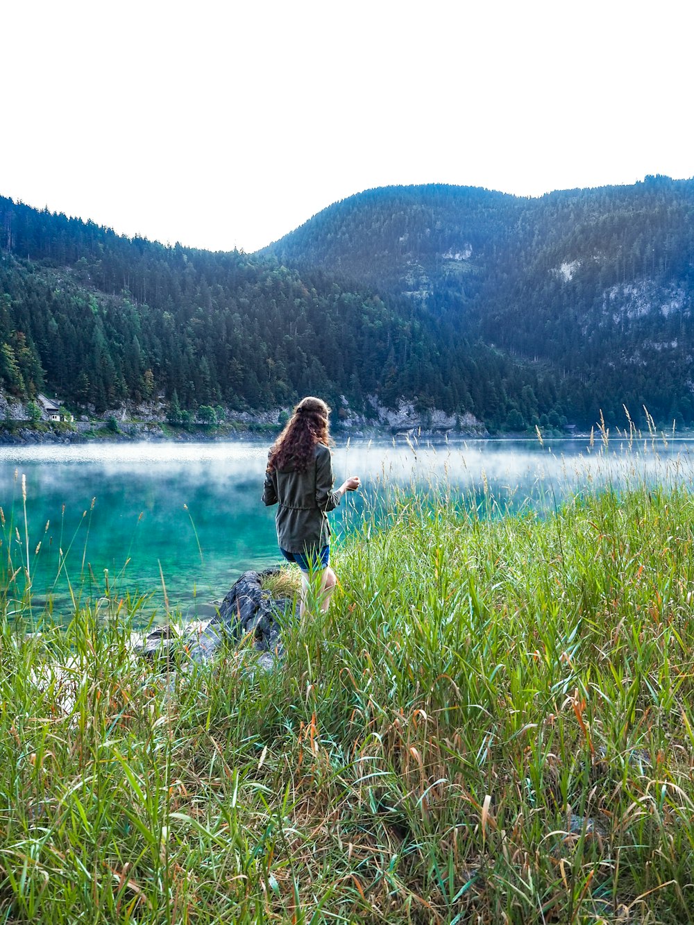 woman standing near body of water