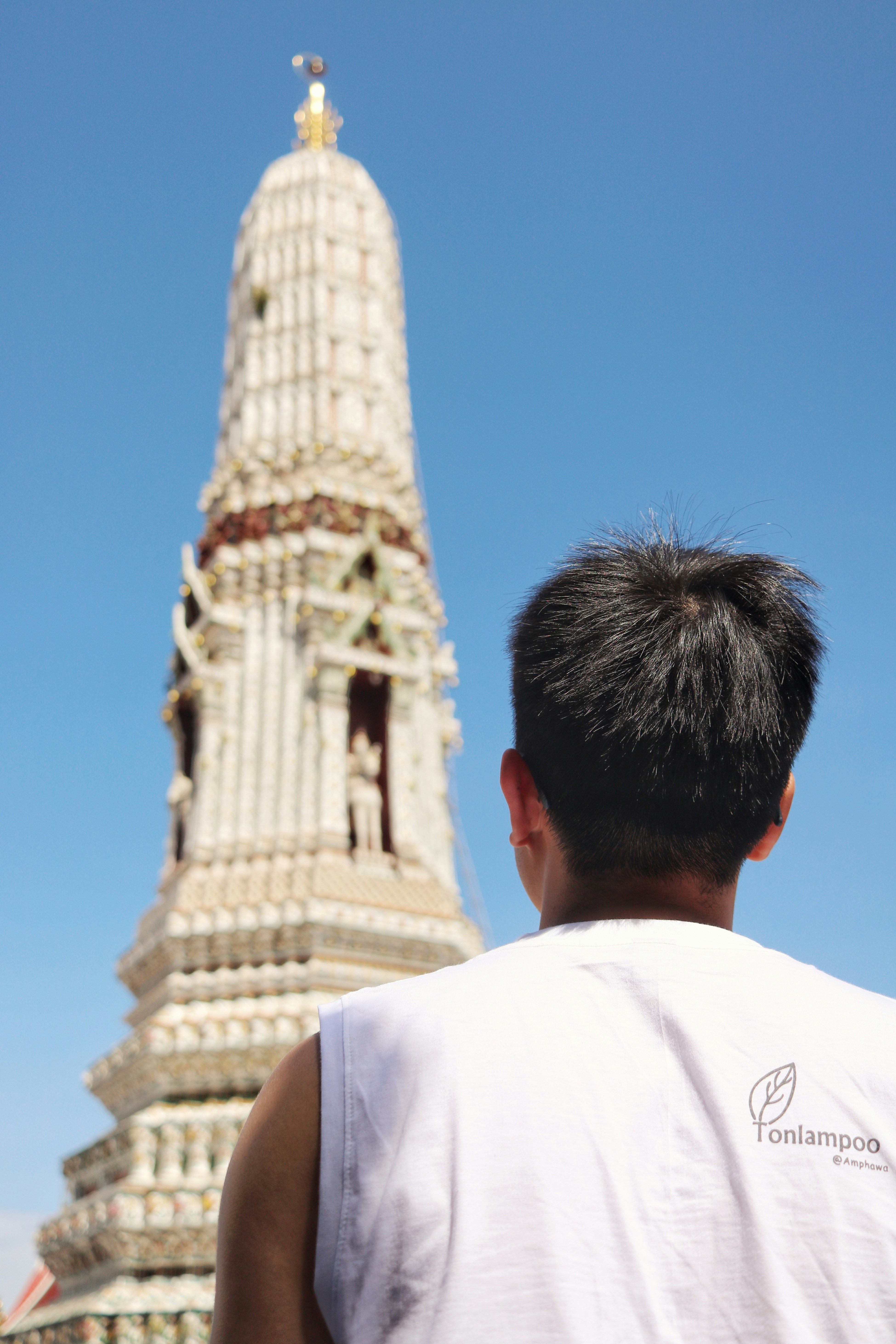 man facing tower during day
