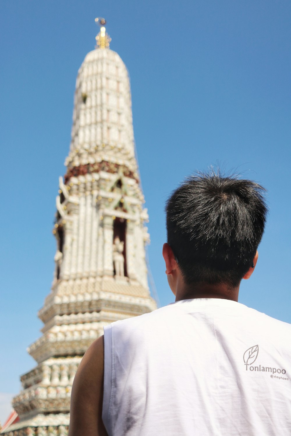 man facing tower during day