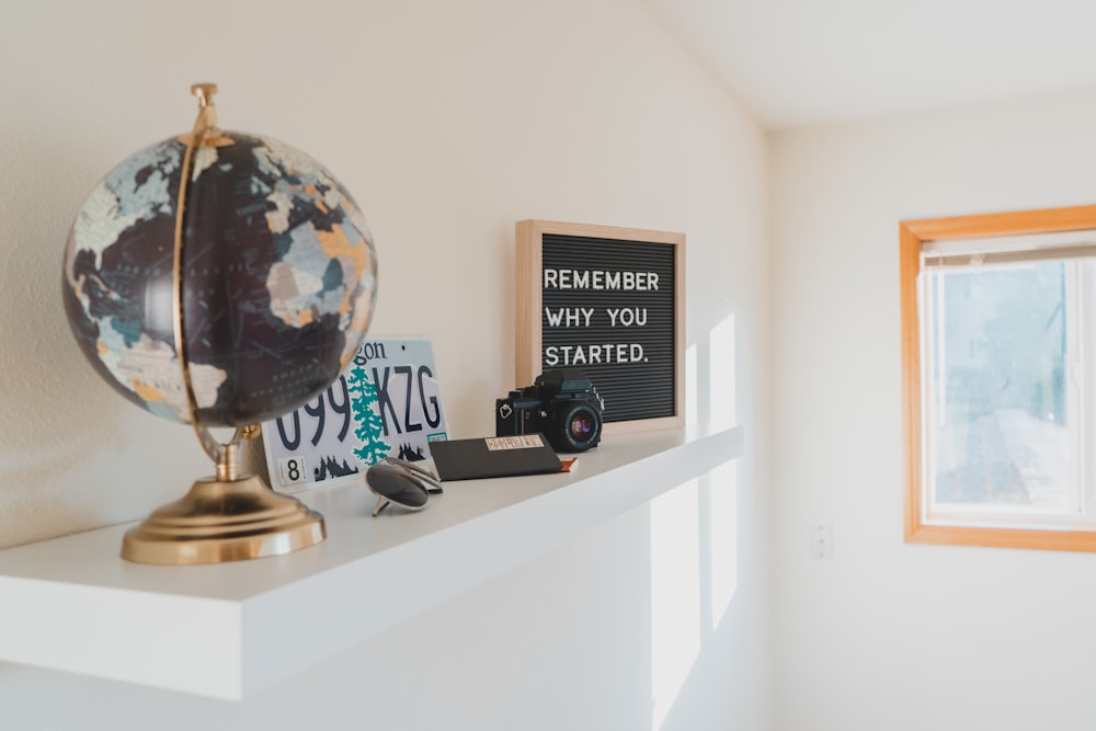 black and brown desk globe