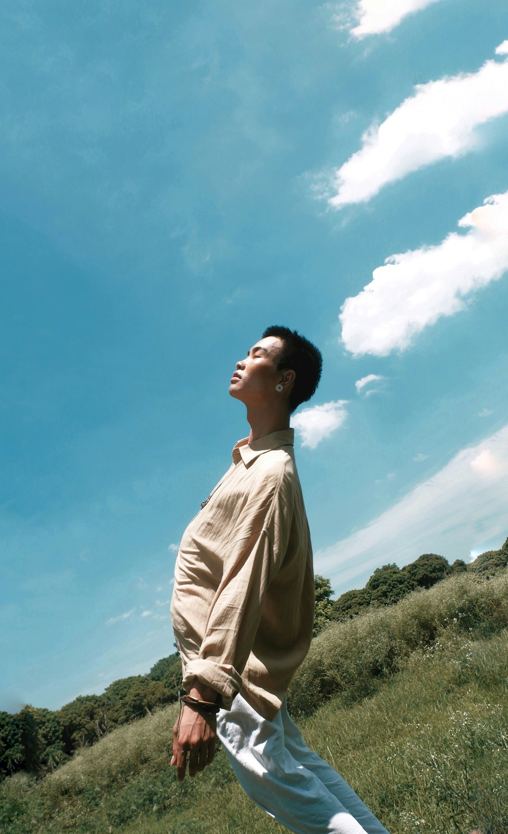 man standing on grass field