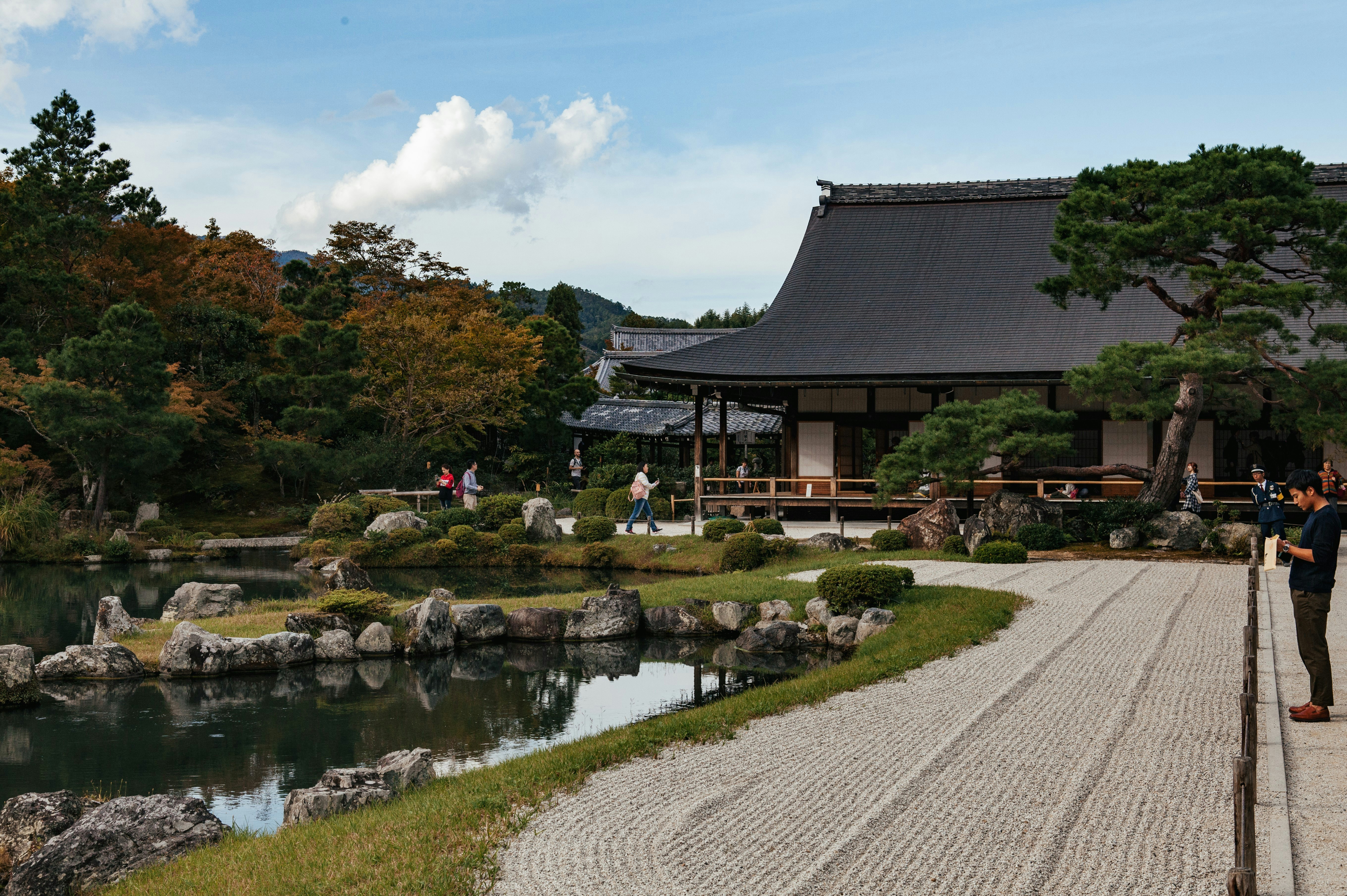 a couple of people that are standing in front of a building