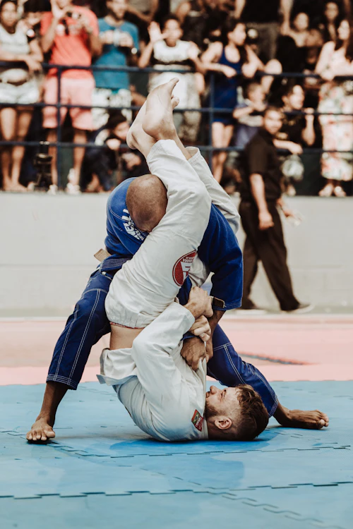Two athletes sparring in taekwondo