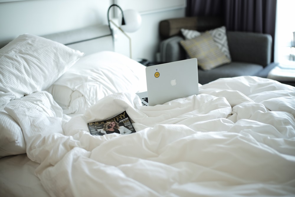 white comforter set and MacBook White
