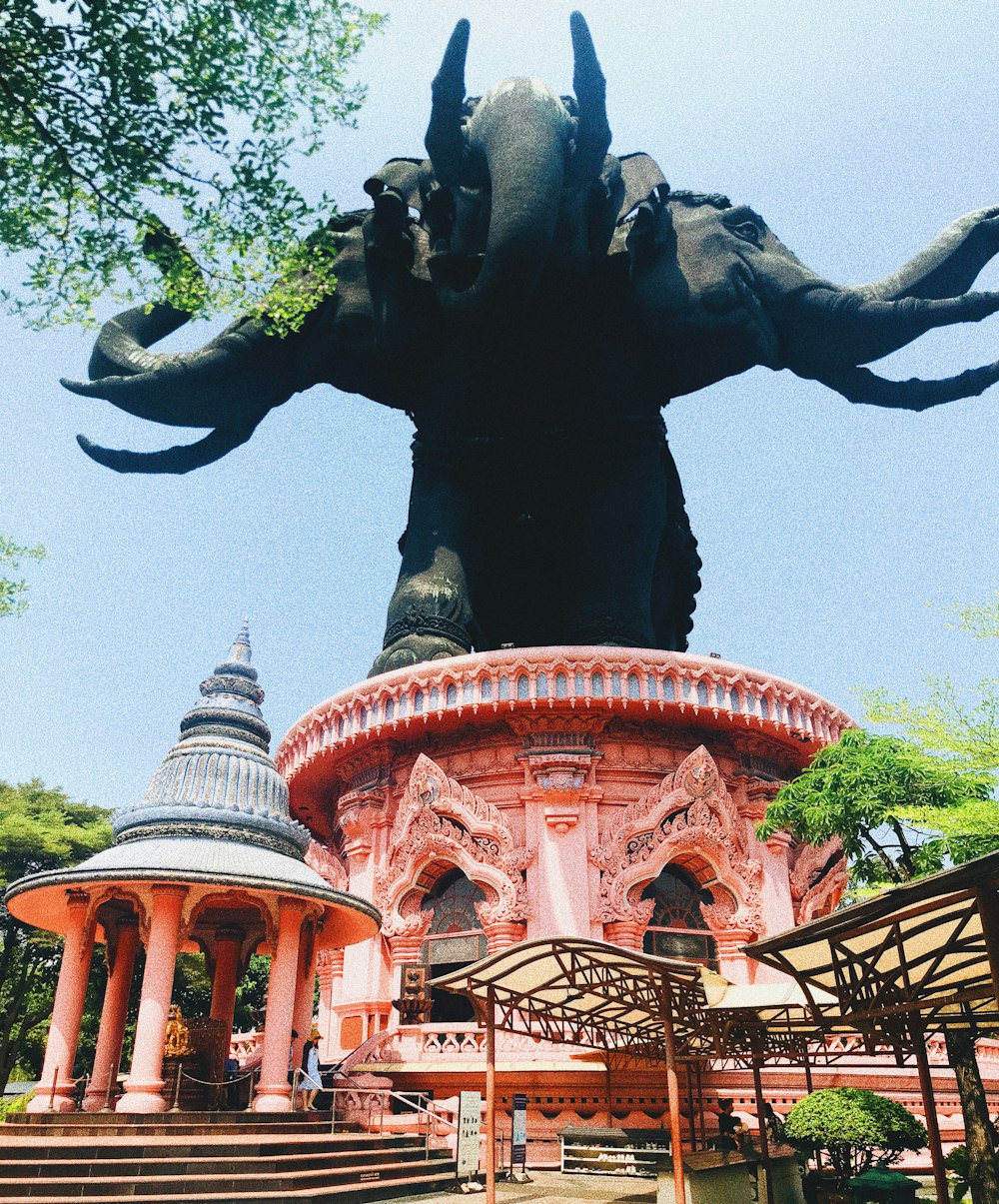 red and gray temple near green trees