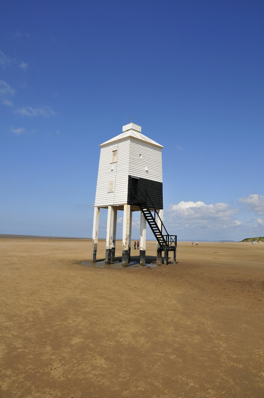 a lifeguard tower on a sandy beach