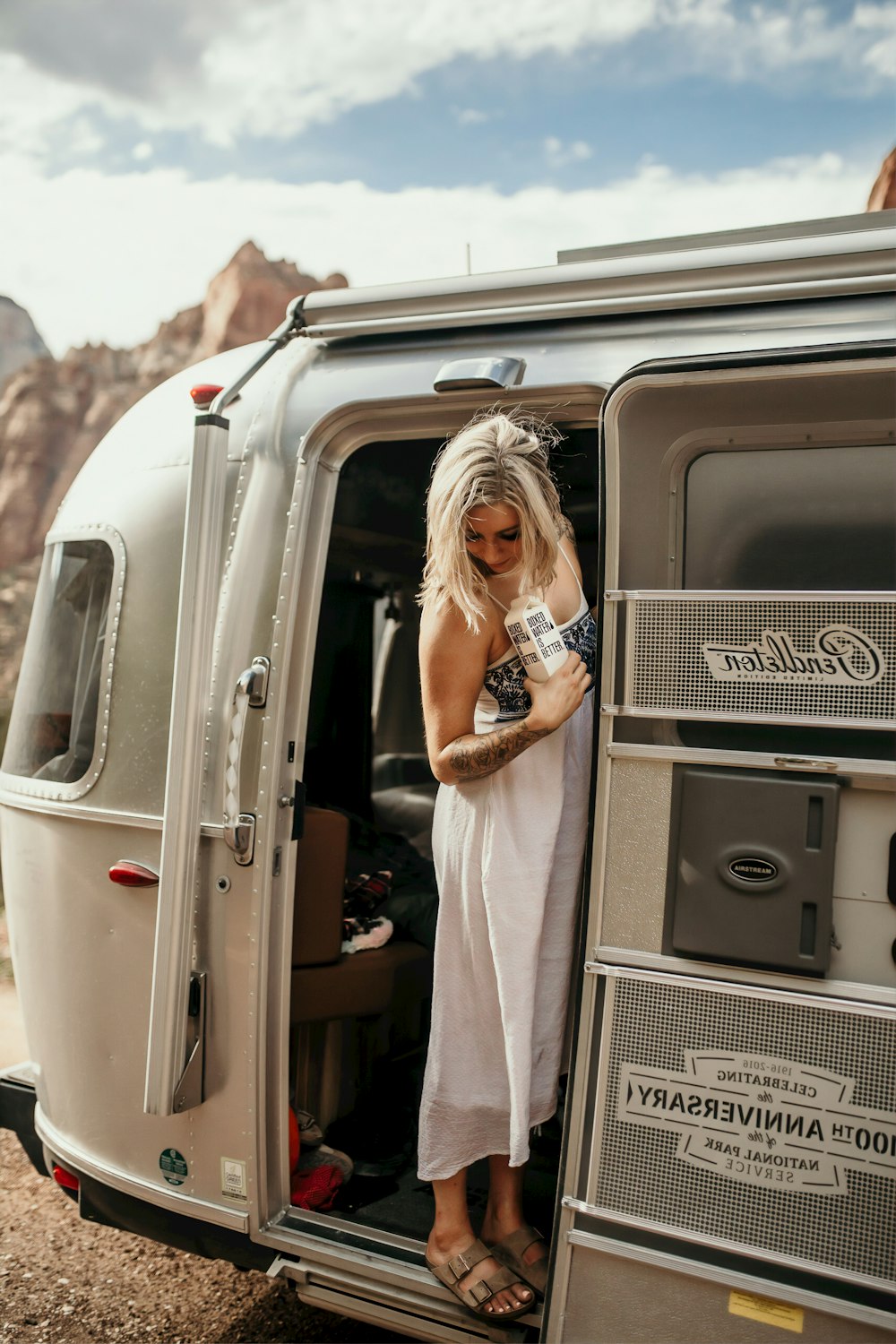 woman standing on vehicle door