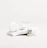 A white, sleek container with the brand name 'Candid', a small bottle labeled 'Whitener', and a clear dental aligner rest on marble slabs. The composition is minimalist with an emphasis on dental care products.