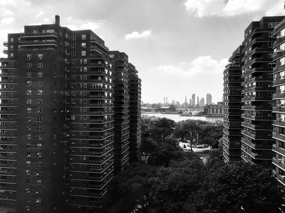 a black and white photo of some very tall buildings