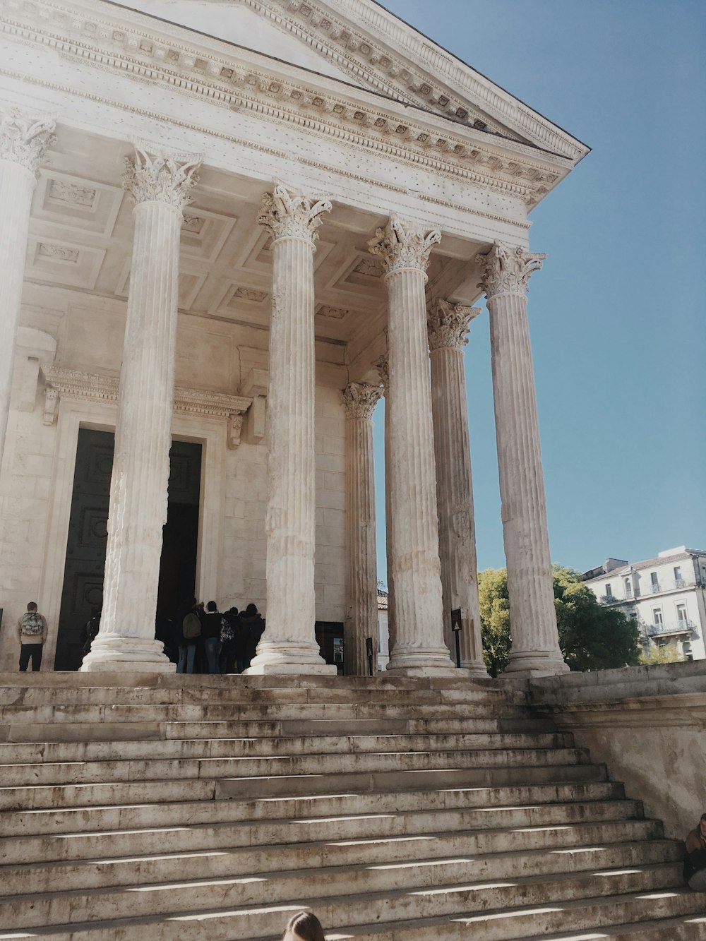 people standing in white building