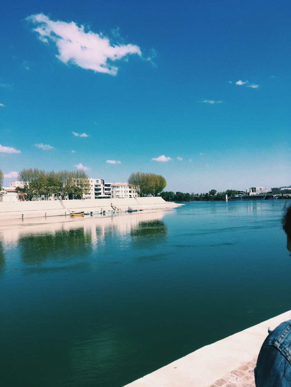 white concrete building near body of water during daytime