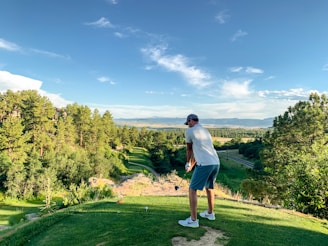 man playing golf during daytime
