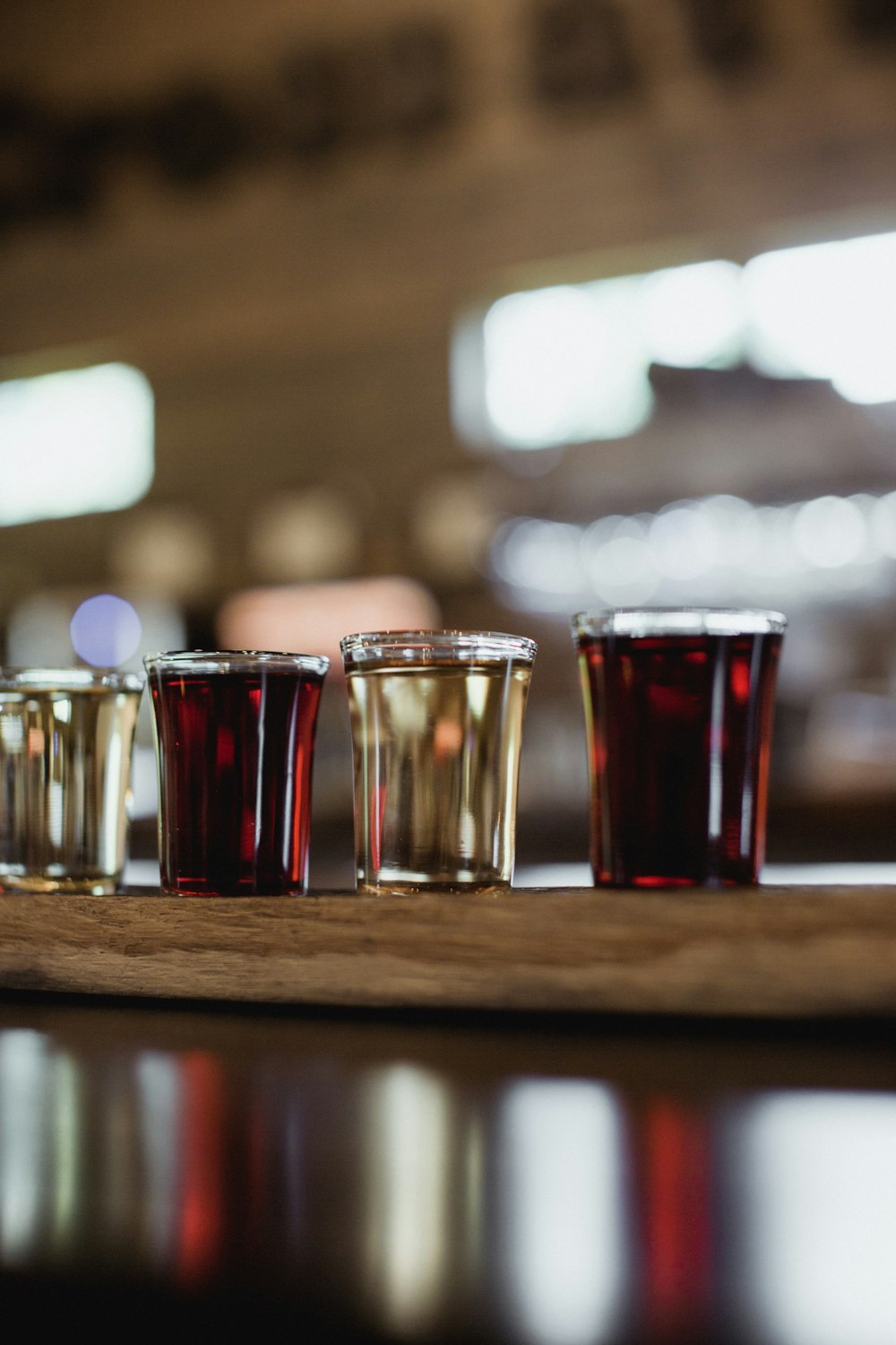 four clear shot glasses