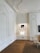 Photo of a bright, freshly painted living room with crisp white walls and elegant trim, showcasing expert craftsmanship.