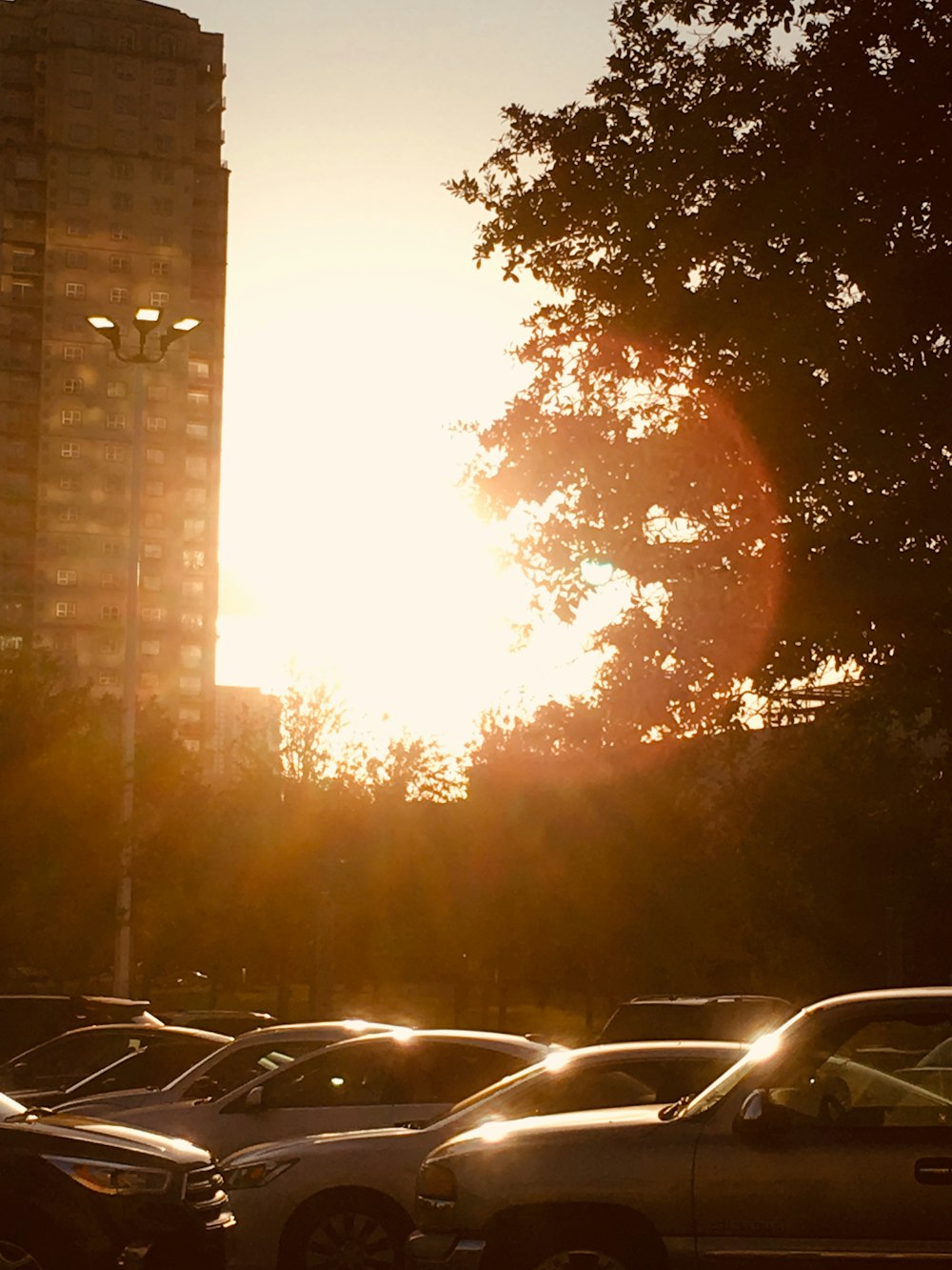 a parking lot filled with lots of parked cars