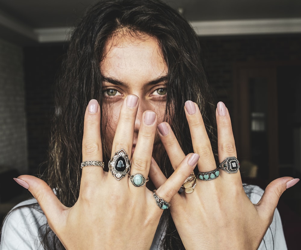 woman showing her rings on her fingers