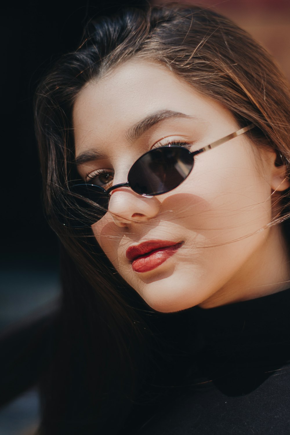 closeup photo of woman wearing black sunglasses