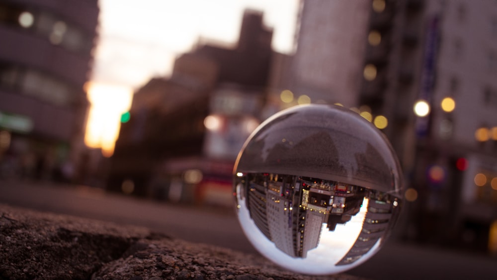 city with high-rise buildings at night lensball photography