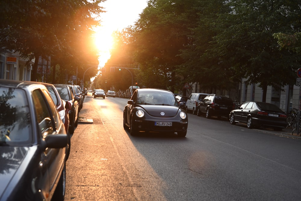 black Volkswagen New Beetle on road