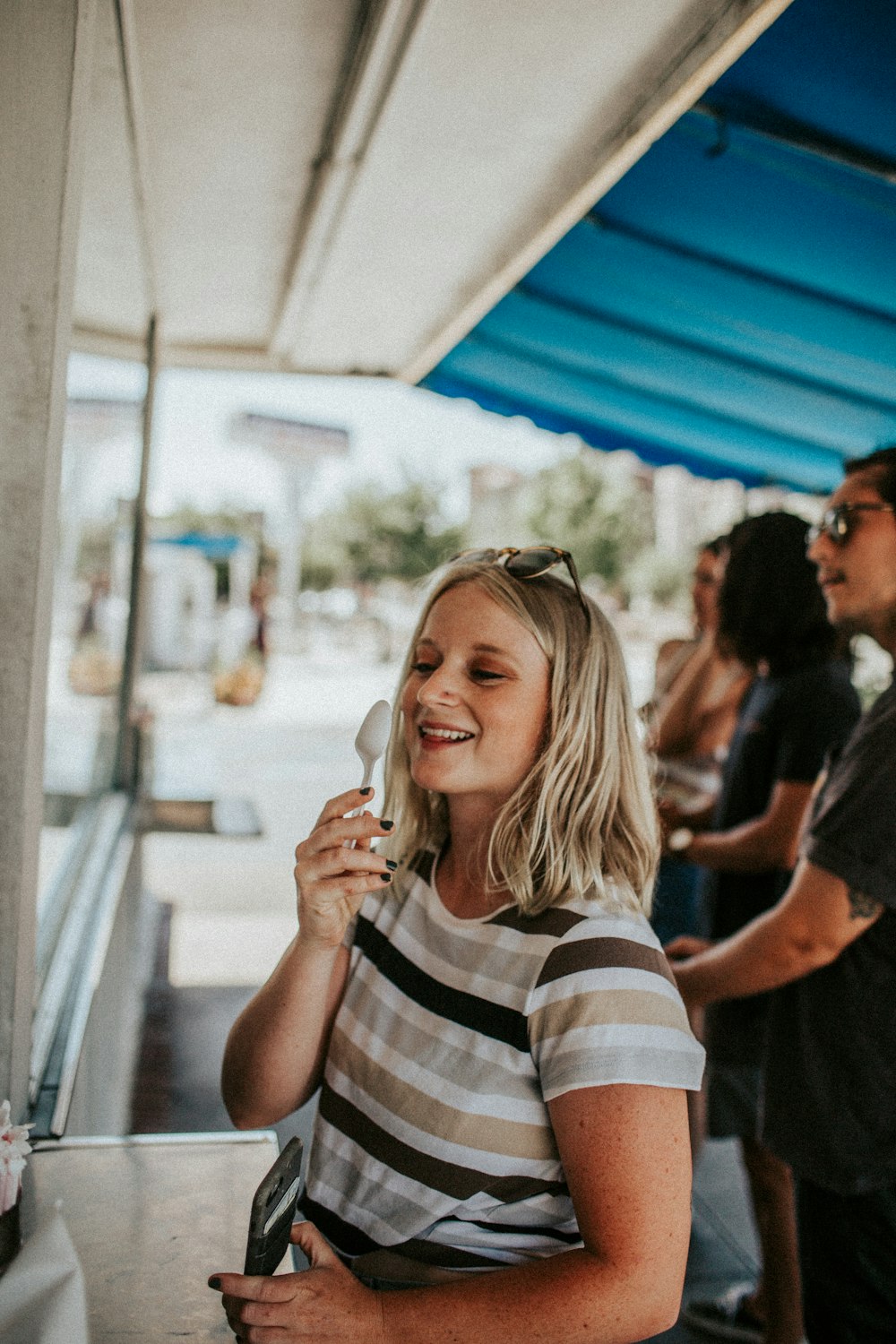 woman wearing white and brown striped T-shirt