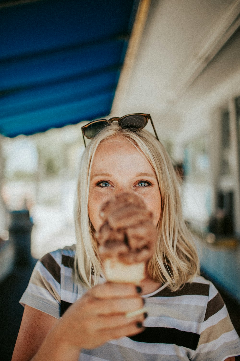 woman holding chocolate ice cream