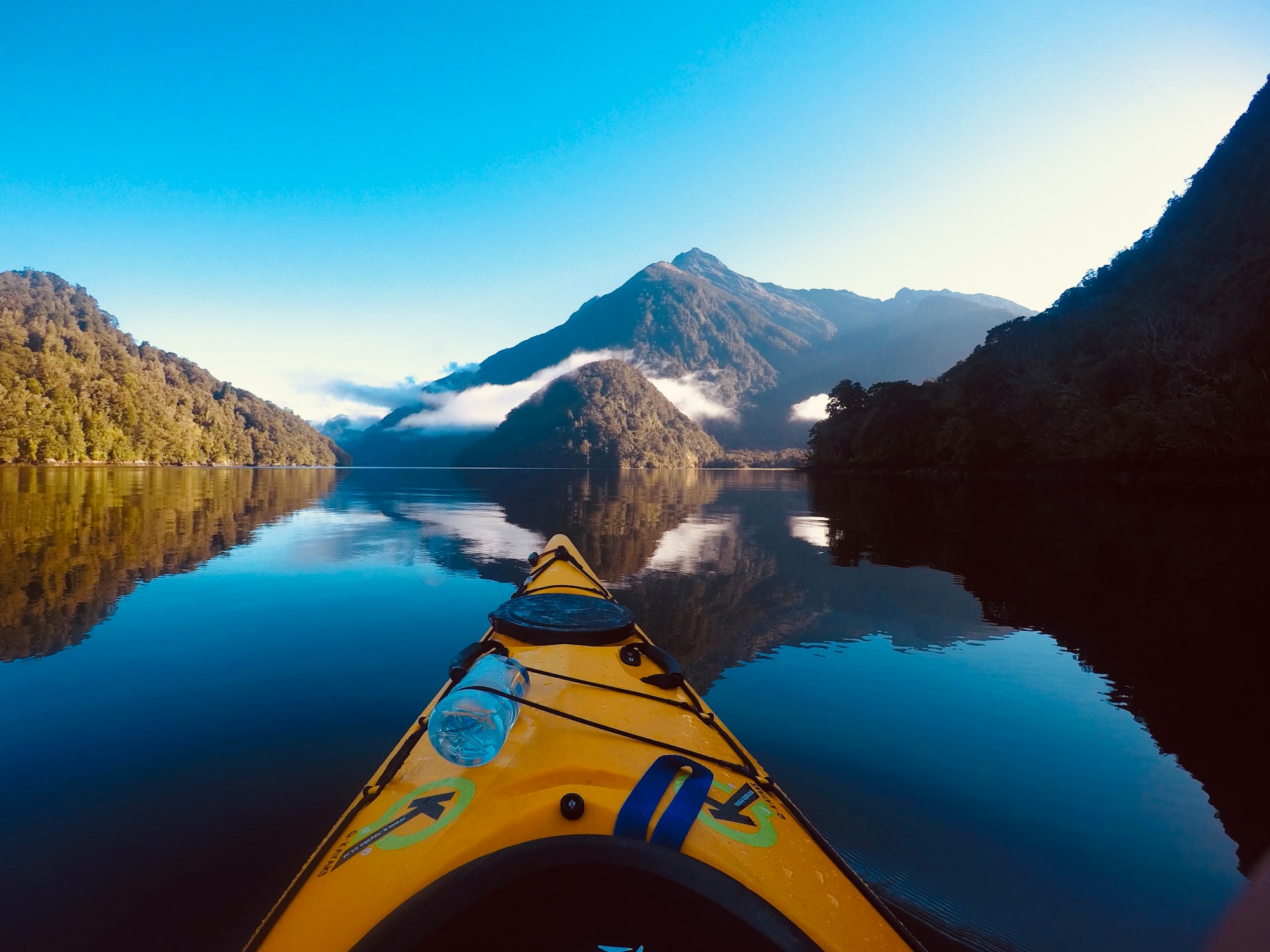 mountains near body of water during daytime