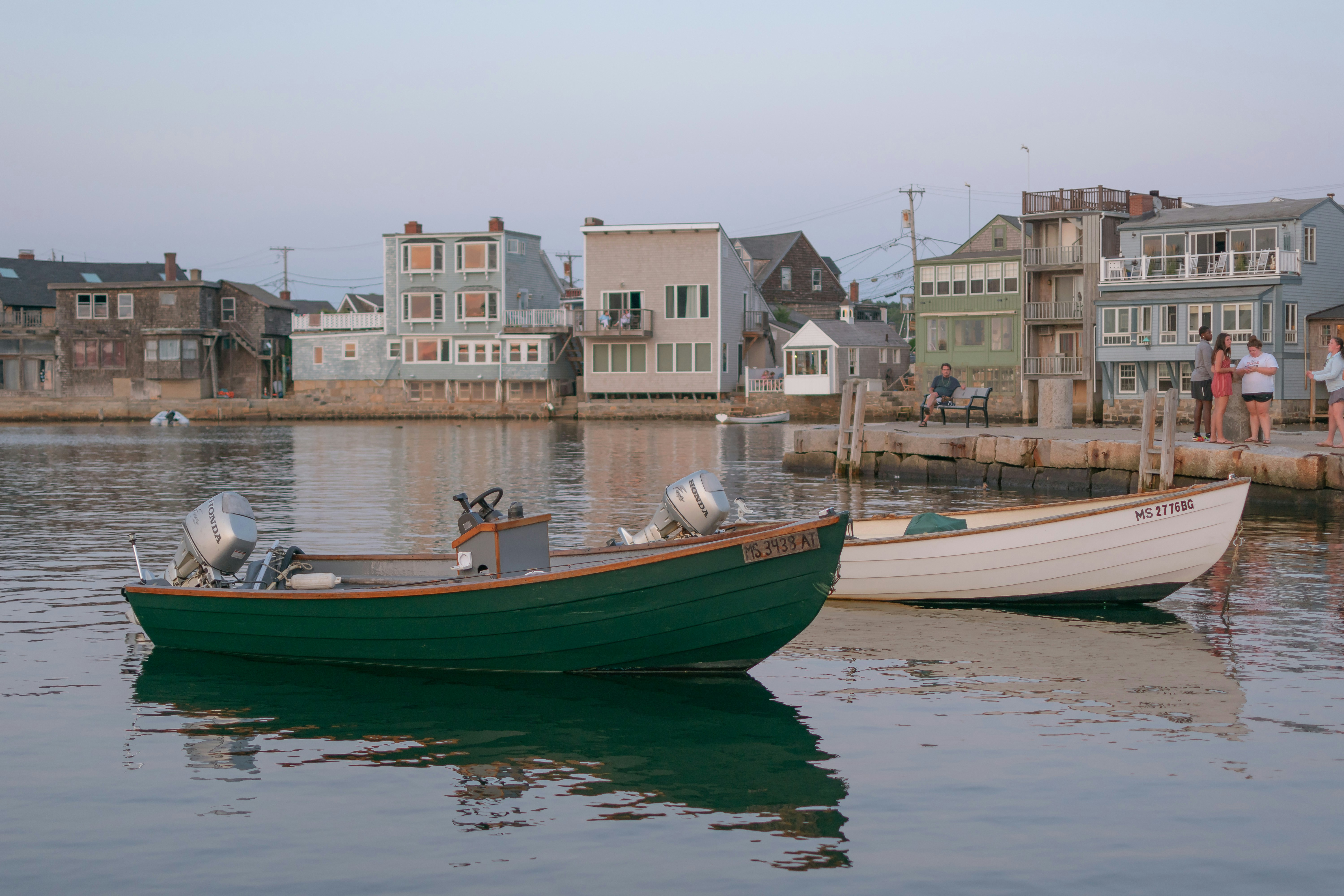 green and white canoe on the ocean